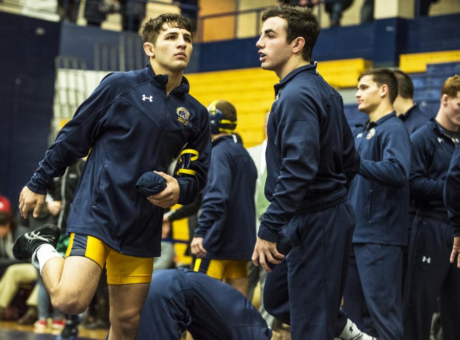 Then a sophomore, Anthony Tutolo (left) warms up before the Thanksgiving Throwdown on Tuesday, Nov. 22, 2016, at the M.A.C. Center. 