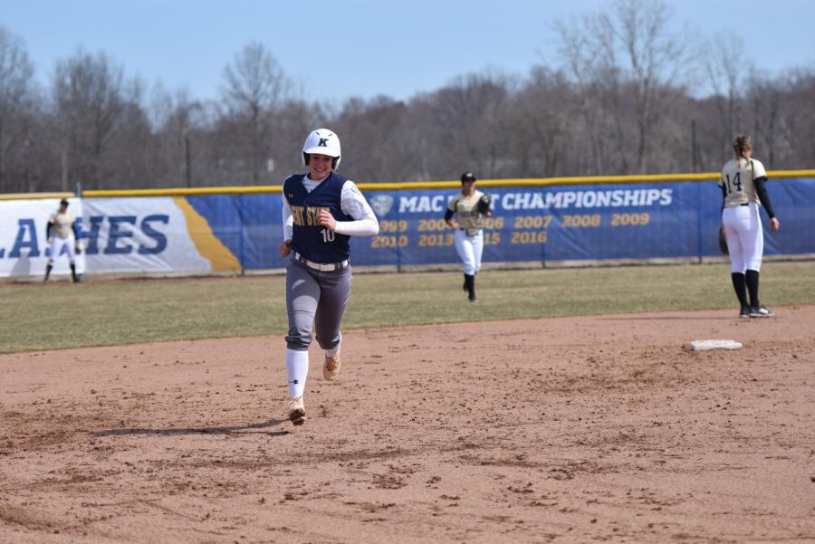 Kent State senior shortstop Holly Speers smiles as she rounds the bases on her eighth home run of the season during Kent State's 8-7 win over Western Michigan on March 24, 2018. Speers went 1-for-2 with nine walks on the weekend. 