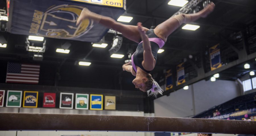 Senior Rachel Stypinski on the balance beam during Kent State’s annual Pink Meet, scoring a 9.925. The Flashes lost the meet against Eastern Michigan with a final score of 194.875-193.925. [FILE]