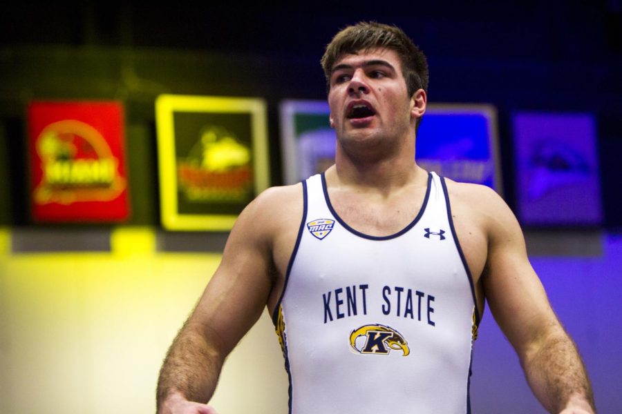 Senior Stephen Suglio takes a breath of celebration after winning by pin in his match against Central Michigan Sunday, Feb. 11, 2018. [FILE]