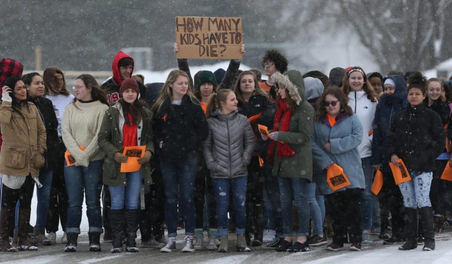 Students at Theodore Roosevelt High School stand outside as part of a national school walk out March 14 in response to gun violence and in remembrance of those killed in Parkland, FL.