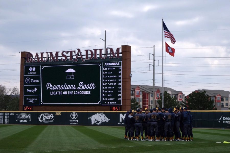 The Kent State baseball team convenes following a game at Arkansas' Baum Stadium. The Flashes lost the series, but picked up their first win against a top 10 team since 2012. 