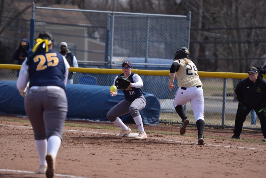 Kent State’s Madi Huck throws the ball to Hunter Brancifort at first base for the out during the Flashes' 1-0 victory over Western Michigan on March 24, 2018.