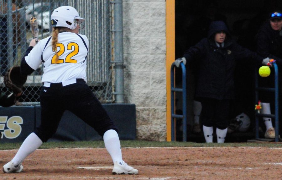 Junior Jen Cader swings during the first game of Kent State's doubleheader against Ohio on April 11, 2018. The Flashes lost, 4-2.