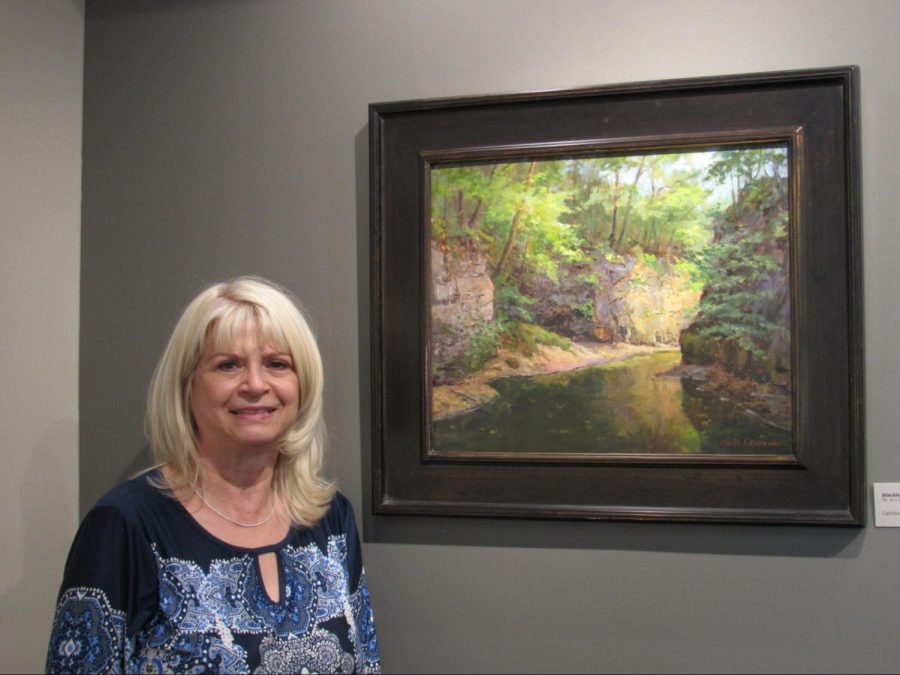 Carolyn Lewis stands by one of her compositions.