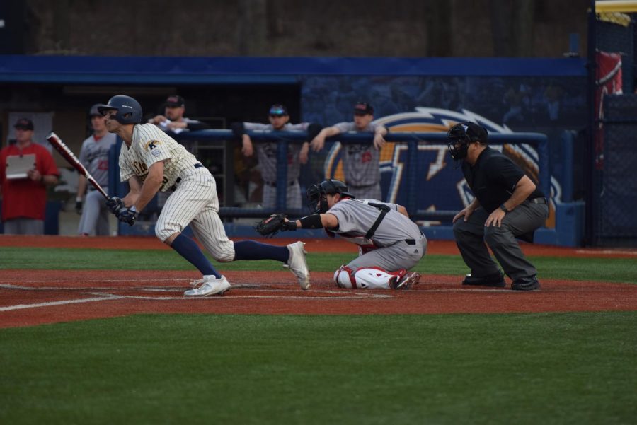 Senior Brad Hamilton heads toward first base after a base hit during the second game of Kent State's doubleheader against Northern Illinois on April 13, 2018. The Flashes won the game, 7-2. 