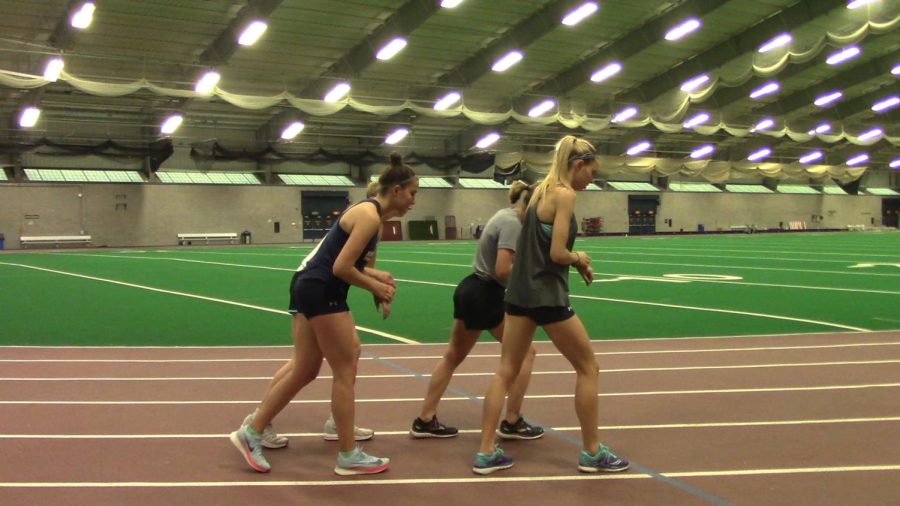 Senior fashion design major Morgan Manuel and teammates Jaimie Adams, Samantha Hyme and Olivia Davis getting ready to begin a one mile rep at practice Tuesday May 1, 2018.