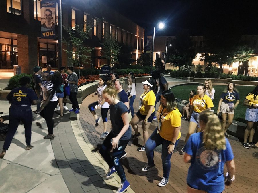 Dancing in unison Flash guides and DKS students finish their long day of touring in front of the Student Center jamming out to music on June 20th.