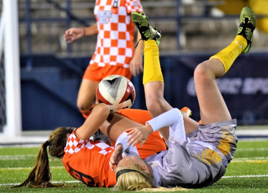 Kent State sophomore defender Amanda Reed collides with Bowling Green freshman midfielder Sophia Barnes at the game Friday, Nov. 3, 2017.