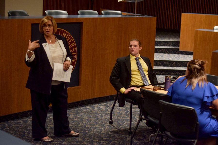 Vice President Shay Little speaks on upcoming changes to meal plans at the Undergraduate Student Government meeting in the Governance Chambers on Wednesday, Aug. 29, 2018.