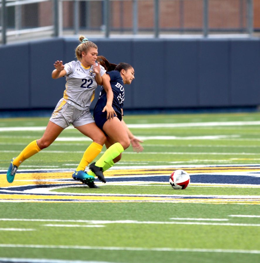 Kent State senior forward Cameron Shedenhelm battles Butler's Gabby Smith during the first half of their matchup on Aug. 16, 2018. Butler beat the Flashes, 3-1.