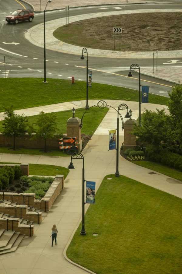 A person walks toward one of the new traffic circles locates on Summit Street on Aug. 29, 2018.