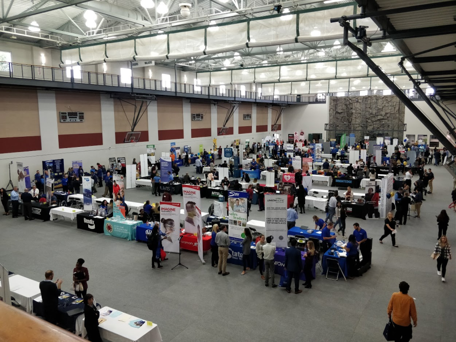 Students talk with potential employers at the Student Recreation and Wellness Center. 