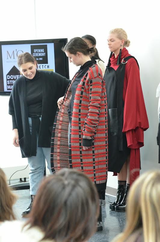 Alanna Lizun, now a Kent State fashion design alumna, prepares models wearing her collection to take the runway in Rockwell Hall on Friday, April 27, 2018 for the annual fashion show, “FS2:Alchemy." 