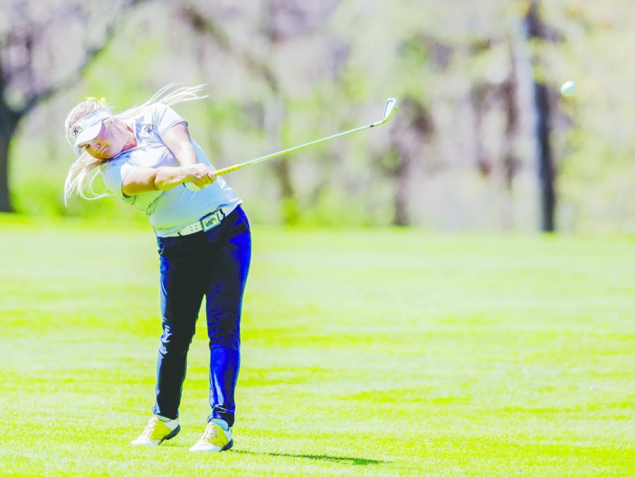 Then-junior Michaela Finn hits from the 12th hole during the Mid-American Conference Women's Golf Championship at Silver Lake Country Club on Sunday, April 23, 2017. Finn placed first and won the individual MAC title. Kent State won its 19th consecutive title. 