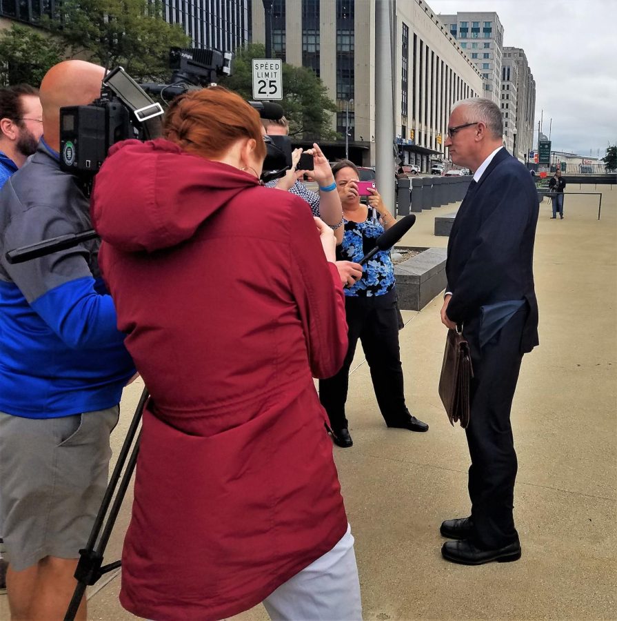 Attorney Warner Mendenhall speaks to reporters about his client, Julio Pino, outside the Carl B. Stoaks U.S. Courthouse Sept. 26, 2018. 