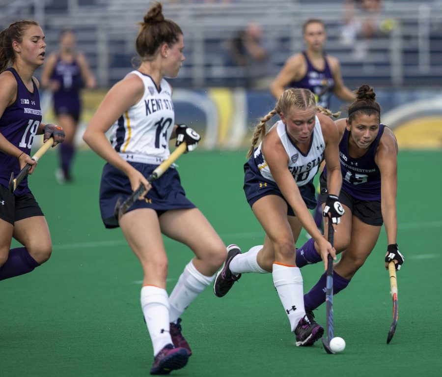 Kent State senior forward Jessica Apelt fights against Northwestern midfielder Lily Gandhi to keep possession of the ball  against Northwestern on Sept. 4, 2018. Kent State lost the match, 4-2.