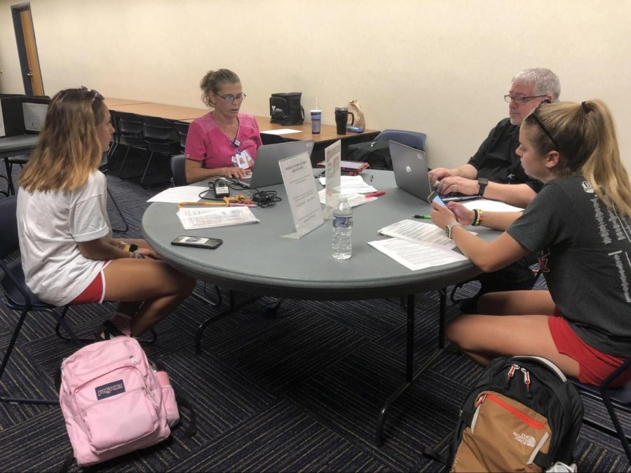 Participants gather around a table at the blood drive Sep. 5, 2018.