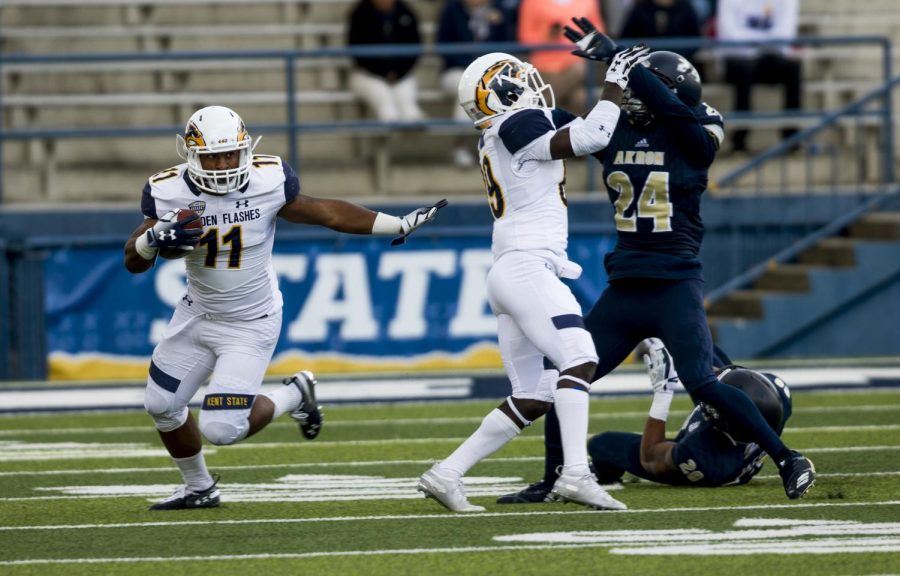 Kent runing back Justin Rankin rushes during first half of the Flashes matchup against Akron on Oct. 20, 2018. The Flashes lost in overtime, 24-23.