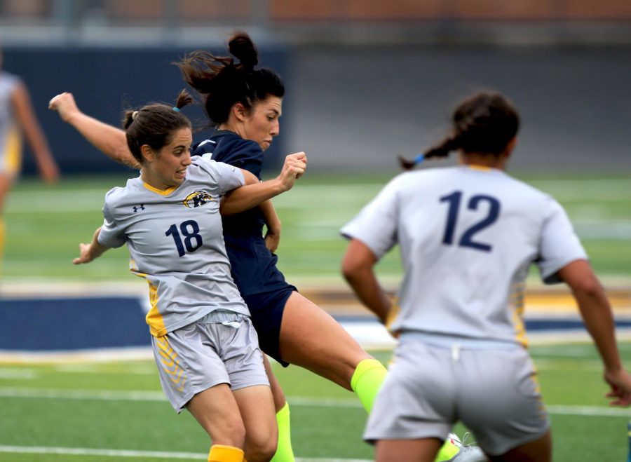 Kent State sophomore midfielder Vital Kats tries to win the ball away from Butler's Gabby Smith during the first half of their matchup on Aug. 19, 2018. Butler beat the Flashes, 3-1.