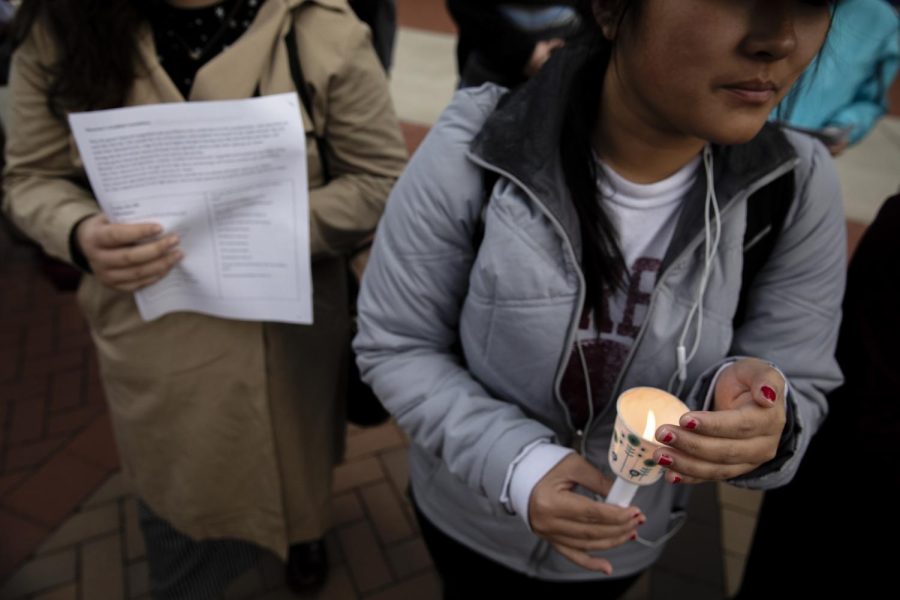 A student holds a candle during a vigil on Oct. 29, 2018 for the victims of the Pittsburgh's Tree of Life synagogue shooting, where a gunman opened fire on worshipers. 