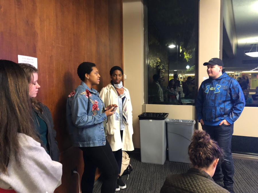 Sophomore entrepreneurship major Charles Marin (right) listens to students ask questions about his experience as an RA at the Information Session in Tri Towers on Tuesday, Oct. 23, 2018.