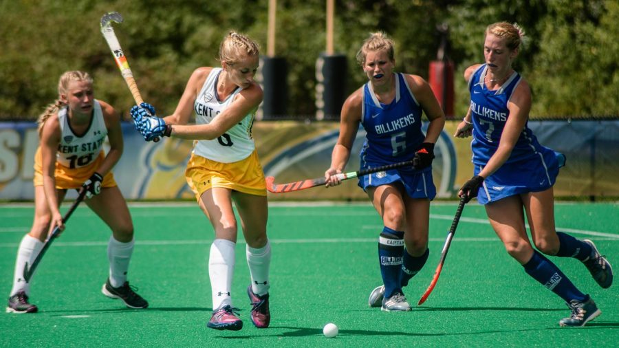 Kent State forward Pippa Best (center-left) battles Billiken's Jess Dunlap for possession. 