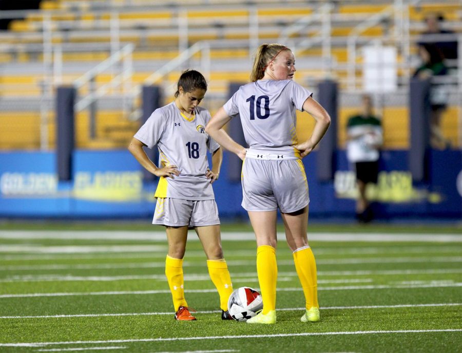 Kent State sophomore midfielder Vital Kats and senior defender Paige Culver prepare to take a free kick during the second half of their matchup against Butler on Aug. 16, 2018. Butler won, 3-1.