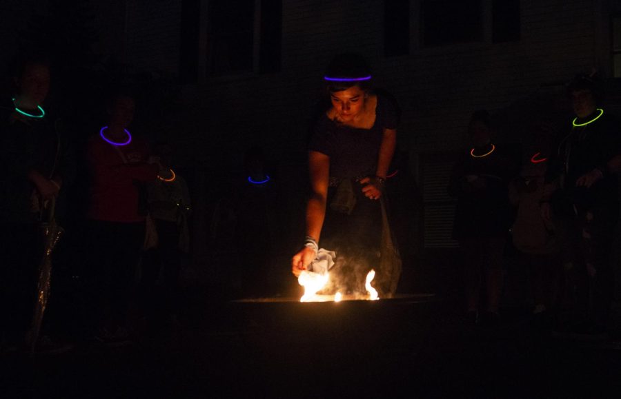 Attendees at the annual Take Back the Night event participate in name burning, a ceremonial burning of name of abusers where the name of the abuser is written on a small piece of paper and placed into the fire in the center of the group. 