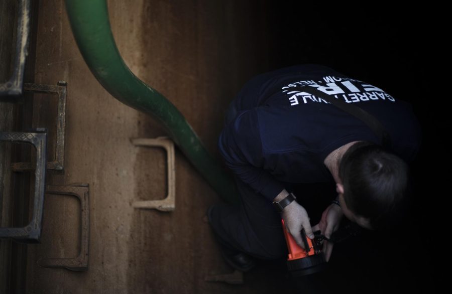 Chris McPherson, a firefighter with the Windham and Garrettsville fire departments, inspects the water level inside the clearwater well at the Windham Water Department in Windham, Ohio, on Oct. 17, 2018. Over 250,000 gallons of water had to be pumped out of the well after a drinking water advisory went into effect Monday due to high manganese levels. “They said it will be better by the end of the day,” said McPherson. “This altogether, I don’t think this will be fixed for another three weeks.”