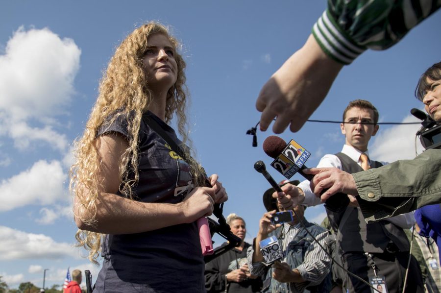 Kaitlin Bennett, the organizer of the open-carry walk, speaks to the press in the Schwartz Center parking lot on Sept. 29, 2018.