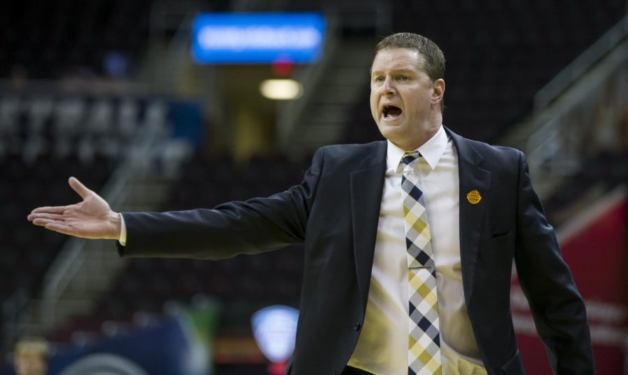 Coach Todd Starkey argues with the referees about calls he believes his players are not getting during the quarter-finals of the MAC Tournament at Quicken Loans Arena in Cleveland, Ohio on Wednesday, March 8, 2017. Kent State lost 67-63.