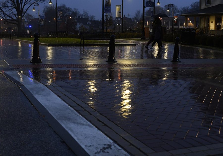 Pedestrians walk past the crosswalk on Lincoln Street November 18, 2018.