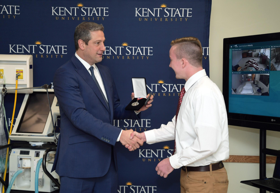 Congressman Tim Ryan awards Austin Croft with the Congressional Award Silver Medal.