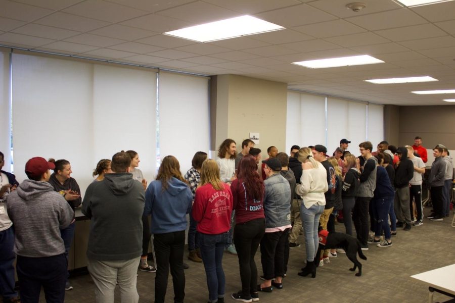 A group of participants take part in a training exercise during the Green Dot Workshop on Saturday, Nov. 3, 2018.