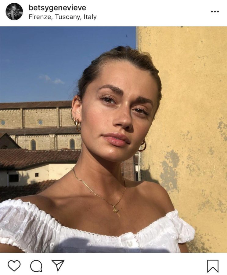 Betsy Garwood, a brand representative for skincare and makeup company Glossier and a senior visual communication design major, poses for a photo in Florence, Italy, on May 31, 2018. Glossier posted Garwood's photo because she was wearing "Last Slick," its mascara. 