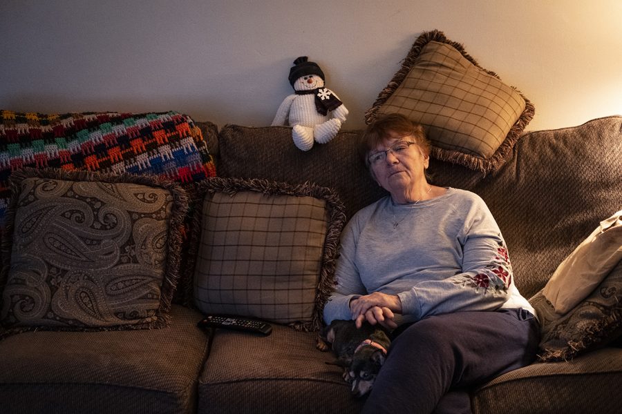 Mary Zieber sits at home on her couch with her miniature pinscher, Pixie, on Tuesday, Nov. 4, 2018. "She has her routine. She doesn't like it when I go out for groceries or something. She thinks it's her time," Zieber said of Pixie.