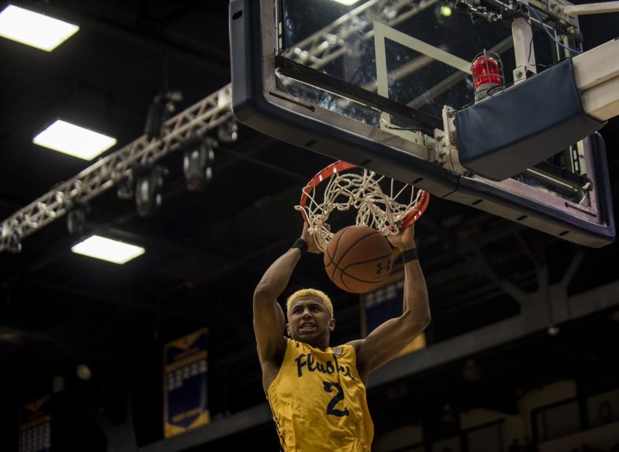 Kent State freshman forward BJ Duling dunks off a pass from Jaylin Walker in the Flashes' 64-63 win over Bowling Green on Feb. 24, 2018, at the M.A.C. Center. Both of Duling's baskets were dunks. 