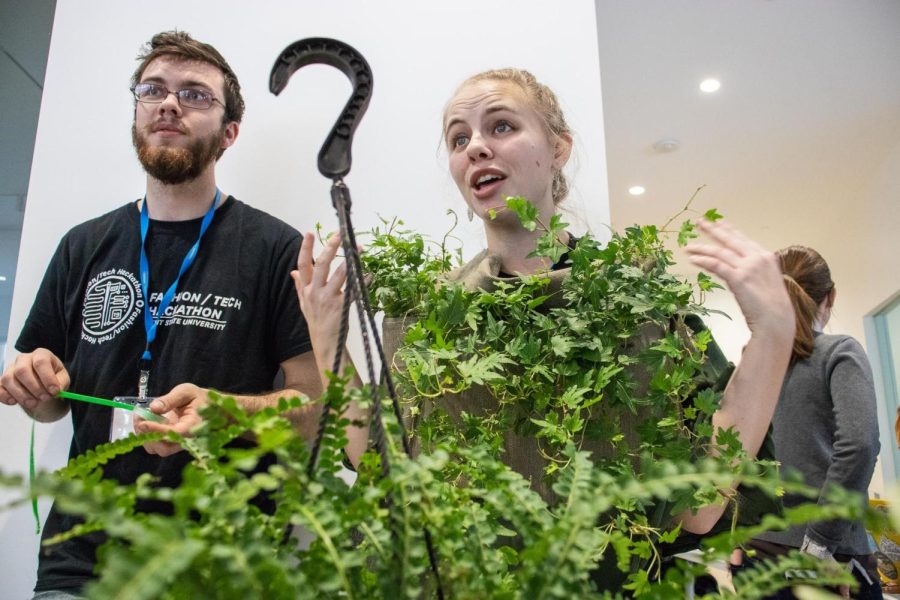 Sidney Cannon-Bailey, an engineering grad student from the University of Pittsburgh, suits up in a blouse decorated with plants to show how they can be seen as a technology and that being around them improves the quality of one’s life on Sunday, Jan. 27, 2019. 