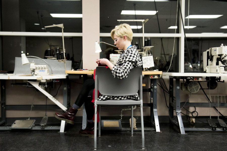 Then-fashion design major Olivia Kissenger sews a design for pants to have a discreet, built-in knee brace for the Fashion/Tech Hackathon in Rockwell Hall Saturday, Jan. 28, 2017. 