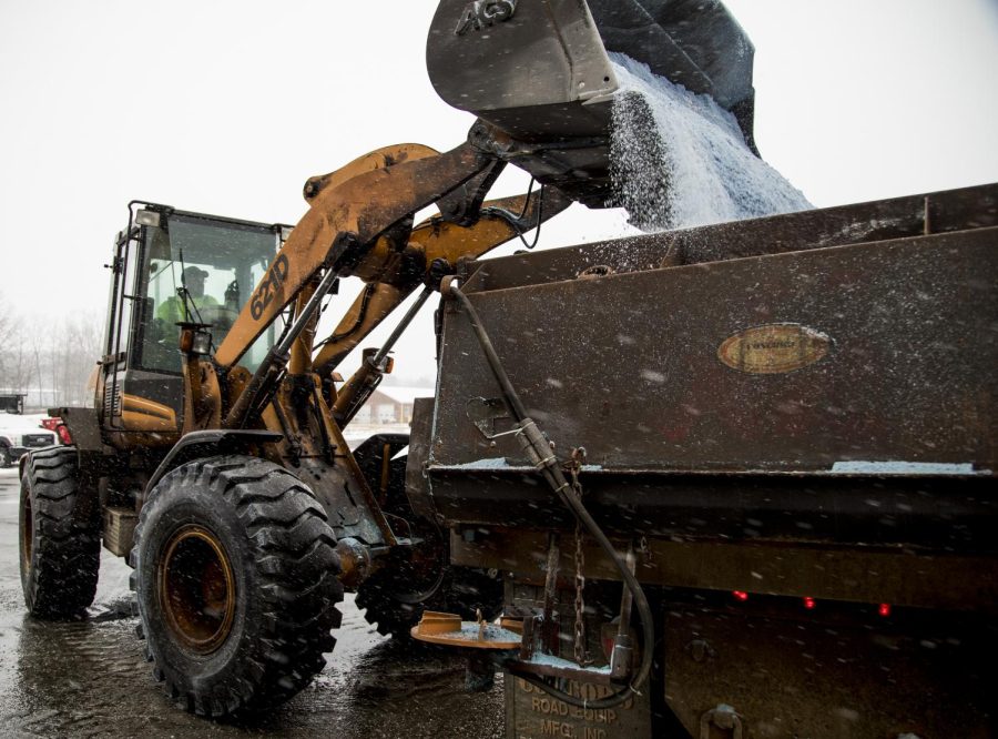 Jeff Derthick, a snow plow operator for the Ohio Department of Transportation, operates a front-end loader as he fills his truck with eight tons of rock salt and prepares for Winter Storm Harper on Saturday, Jan. 19, 2019. He was in the first hours of a 12-hour shift for the city of Ravenna.