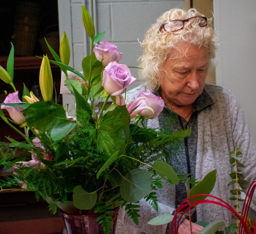 Acorn &amp; Evergreen employee Karen has been a florist for 50 years. "You see a lot of reds and purples around this time of the year, and not as many yellows," she said. 