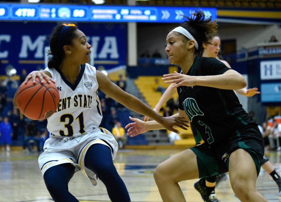 Junior Megan Carter dribbles during the second half of Kent State's matchup against Ohio University on Feb. 23 2019. Kent State lost, 69-67.