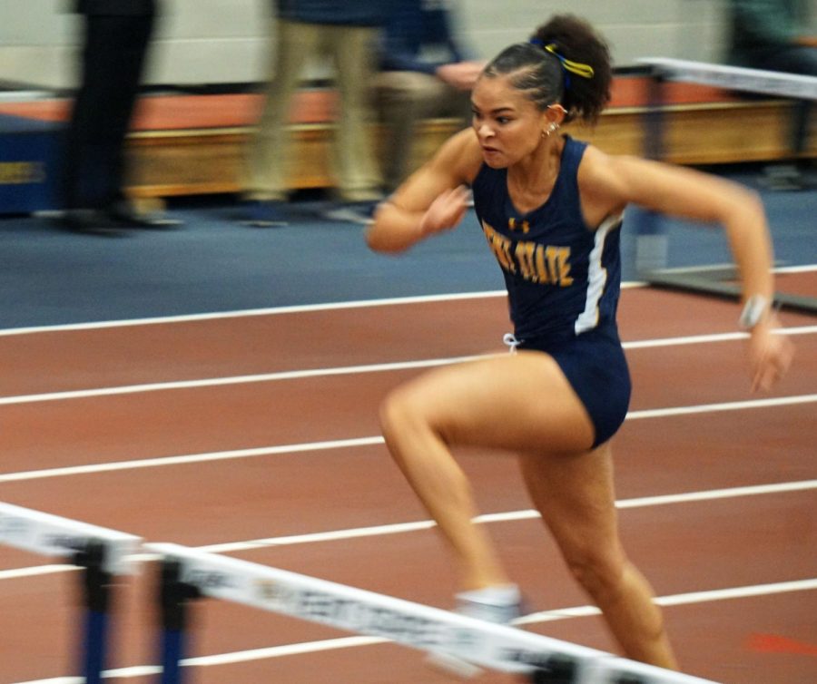 Mi'Angel Daniels vaults herself over the hurdle in the 60-meter hurdles during the Doug Raymond national qualifier held at the Kent State Fieldhouse. Daniels finished seventh in the finals of the event.