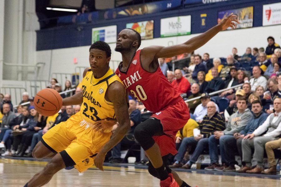 Kent State senior guard Jaylin Walker pushes past Miami's defense on February 5, 2018. Kent State won the game 70-67. 