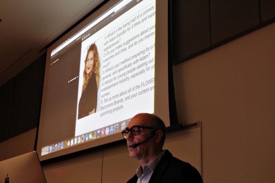 Professor Ron Russo listens to an audio recording of Drew Barrymore herself. Russo and the class listened to Barrymore's advice for students in the classroom.