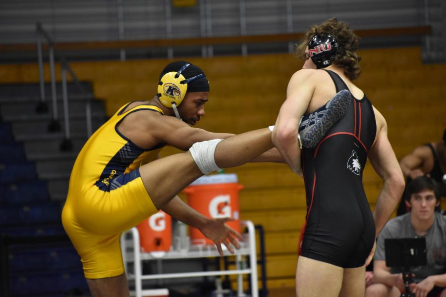 Sophomore Richard Jackson wrestles with Northern Illinois University Husky on February 15.