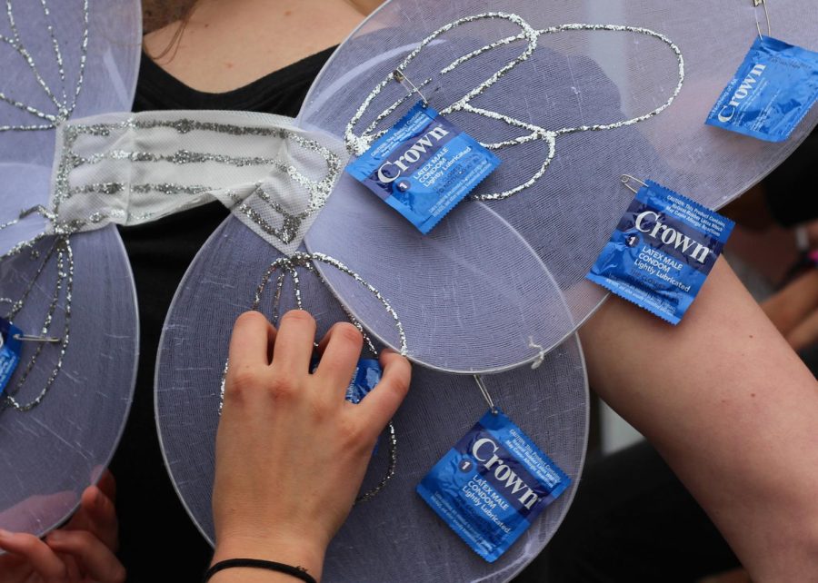 Clara Varndell, a sophomore public health major, adjusts her "condom fairy" wings during Condoms on the K Monday, Oct. 23, 2017. The event kicked off Kent Interhall Council's annual Sex Week.