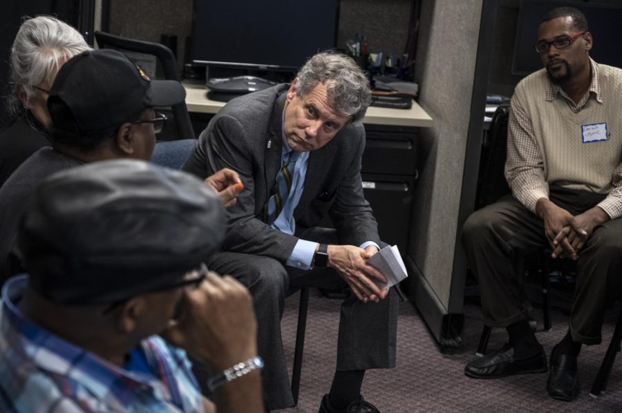 Sen. Sherrod Brown listens as people share their experiences as workers and veterans during a stop in Florence, South Carolina, on his "Dignity of Work" tour March 1, 2019.