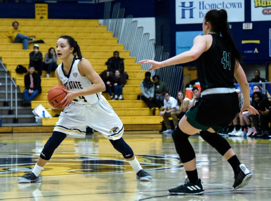 Senior Alexa Golden passes during the second half of Kent State's matchup against Ohio University on Feb. 23. Kent State lost, 69-67.